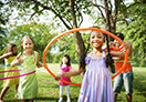 Children playing hula hoop